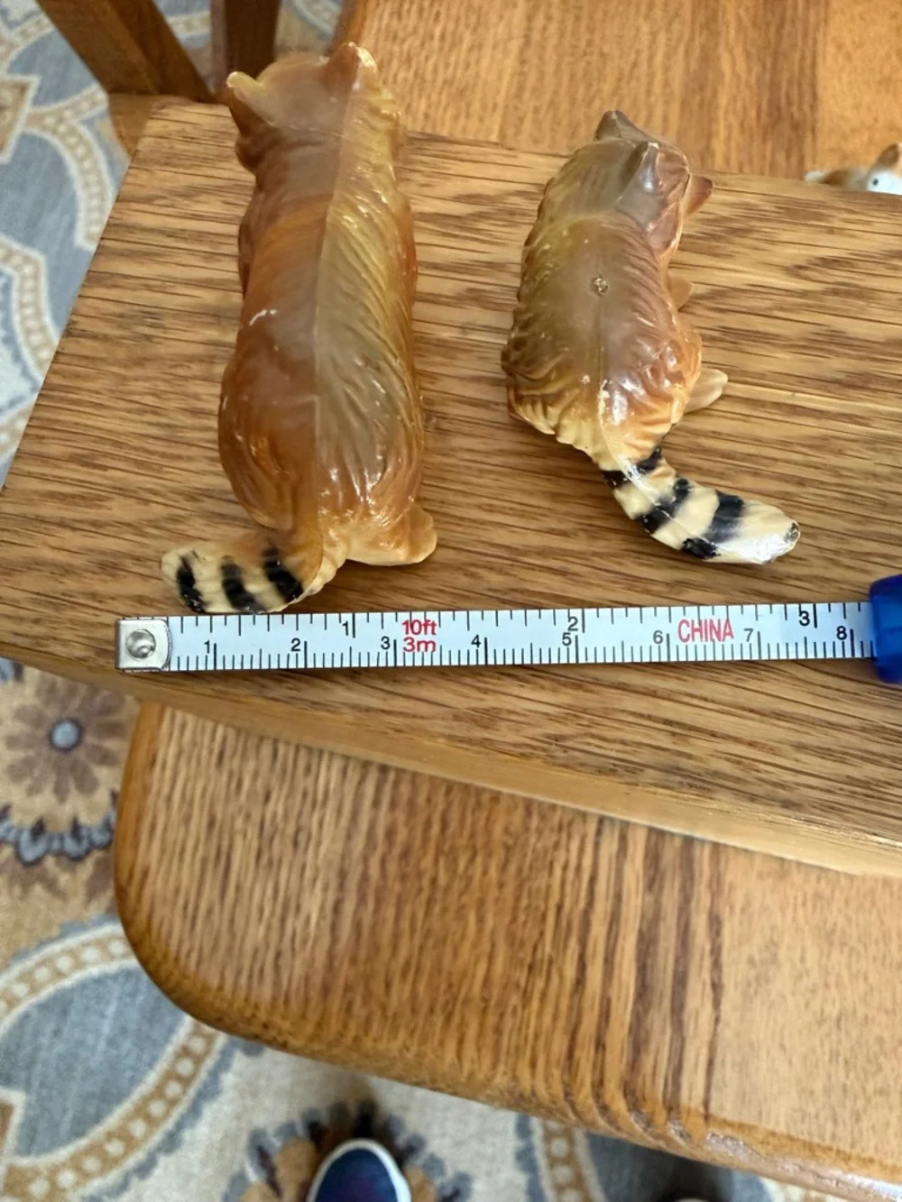 Mini pair of raccoon figurines
